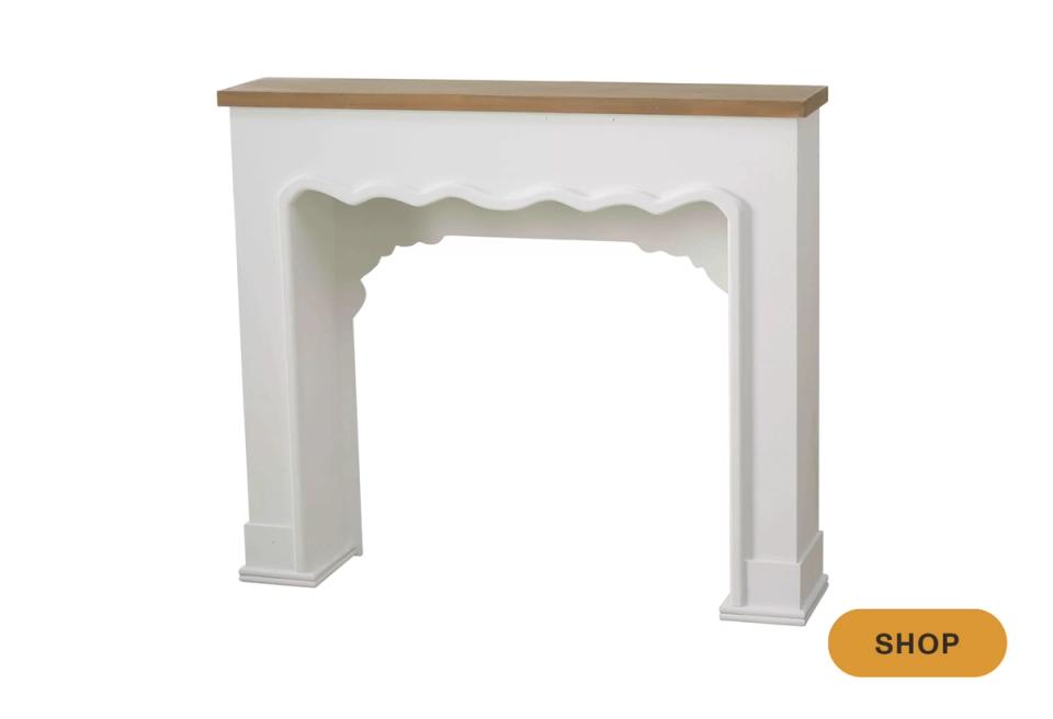 Two-tone faux fireplace mantel with cream base and natural wood top shelf