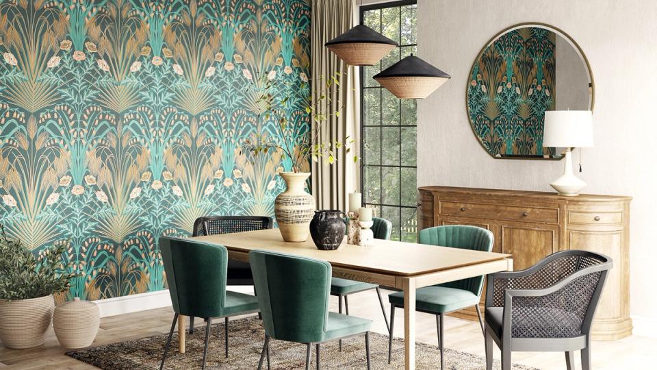 Contemporary dining space with teal patterned wallpaper, white table, and emerald chairs blending pattern and color
