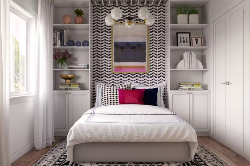Contemporary bedroom with black and white geometric accent wall, built-in shelving, and pop of color for a modern, curated look.