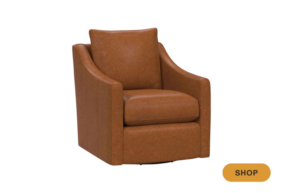 Warm cognac leather swivel chair with traditional tailored design