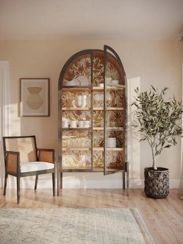 Warm, earthy mid-century modern space with botanical patterned glass cabinet and natural wood furnishings