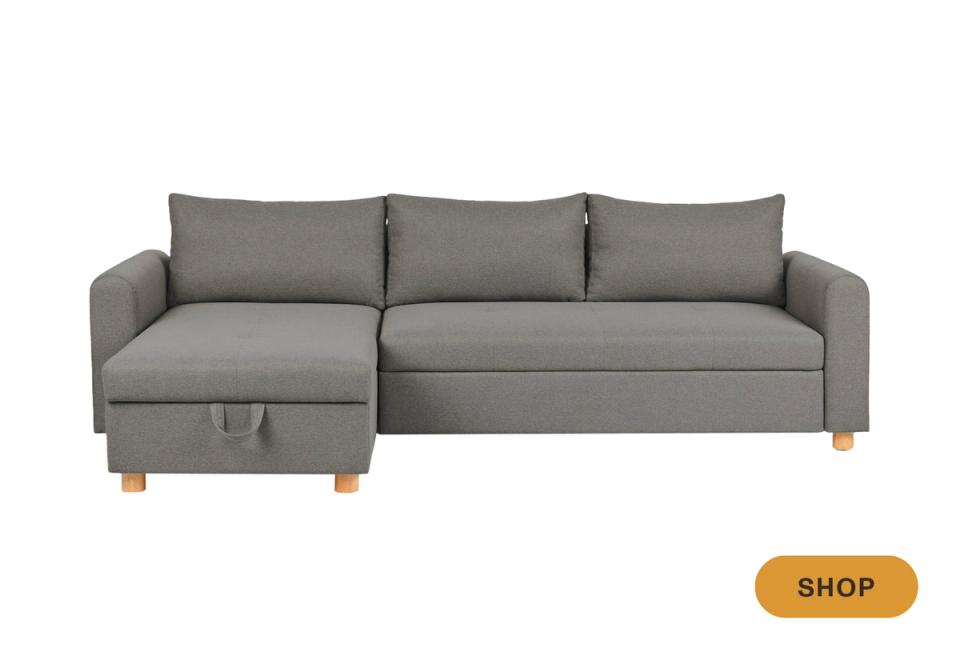 Mid-century modern gray sectional sleeper with wooden legs and storage