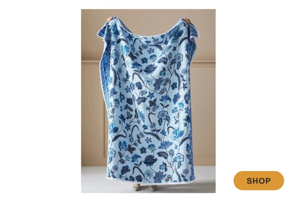 Blue and white botanical throw blanket with organic floral print