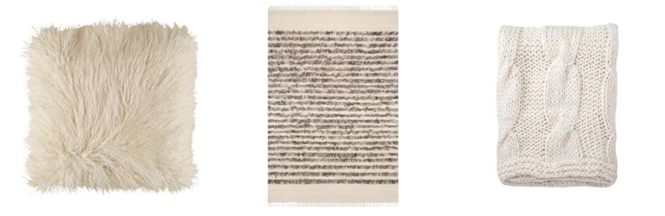 Gallery wall art featuring abstract patterns and vibrant emerald green accent chair