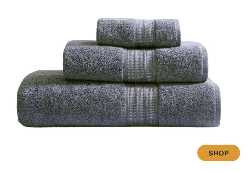 Charcoal gray towels with tonal striped border detail, sophisticated modern elegance