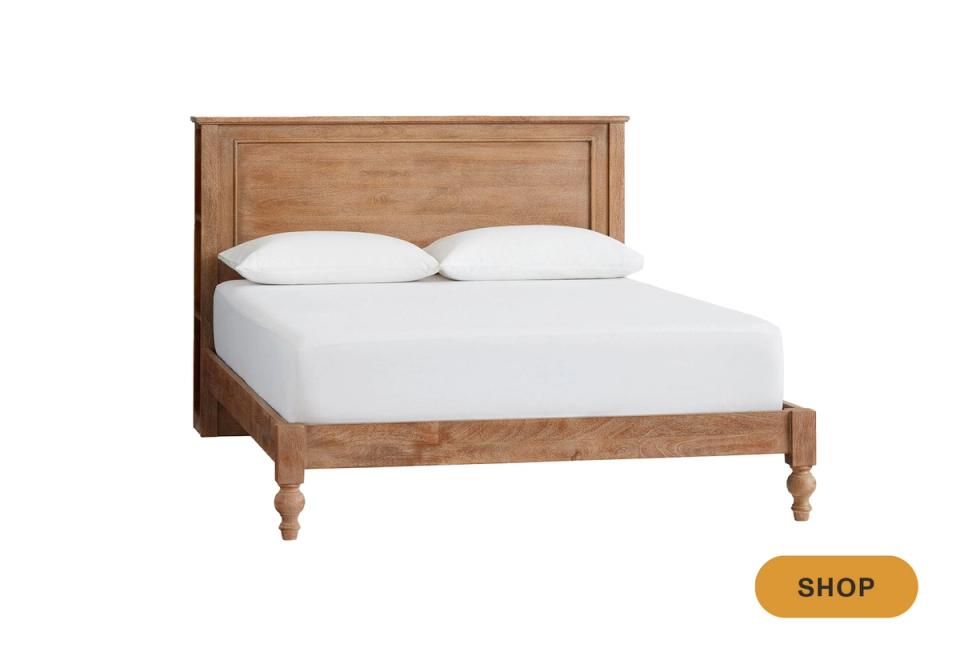 Transitional wooden storage bed with carved details and warm honey-brown finish