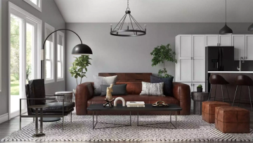 Mid-century modern living room with burgundy sofa, pendant lights, and natural wood tones