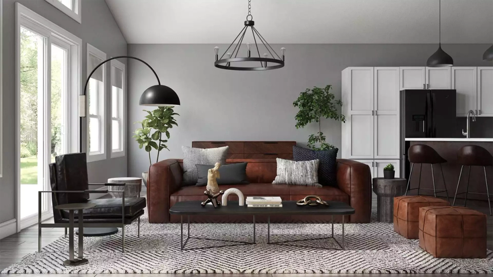 Mid-century modern living room with burgundy sofa, pendant lights, and natural wood tones