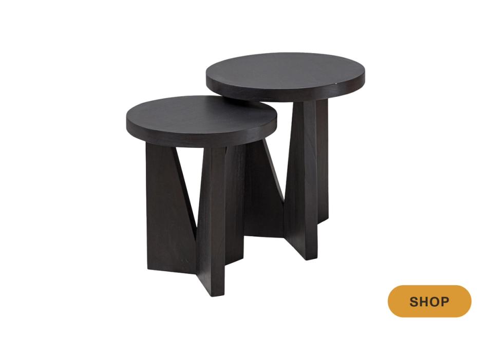 Modern black nesting tables with sculptural pedestal bases for compact spaces