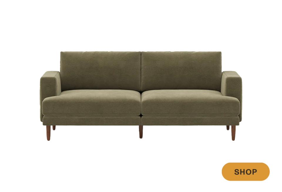Sage green mid-century sofa with tapered wooden legs and clean-lined silhouette