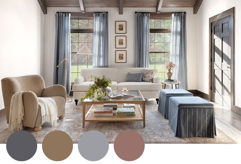Farmhouse living room with warm taupe, gray, and dusty rose palette, natural wood coffee table, and linen upholstery