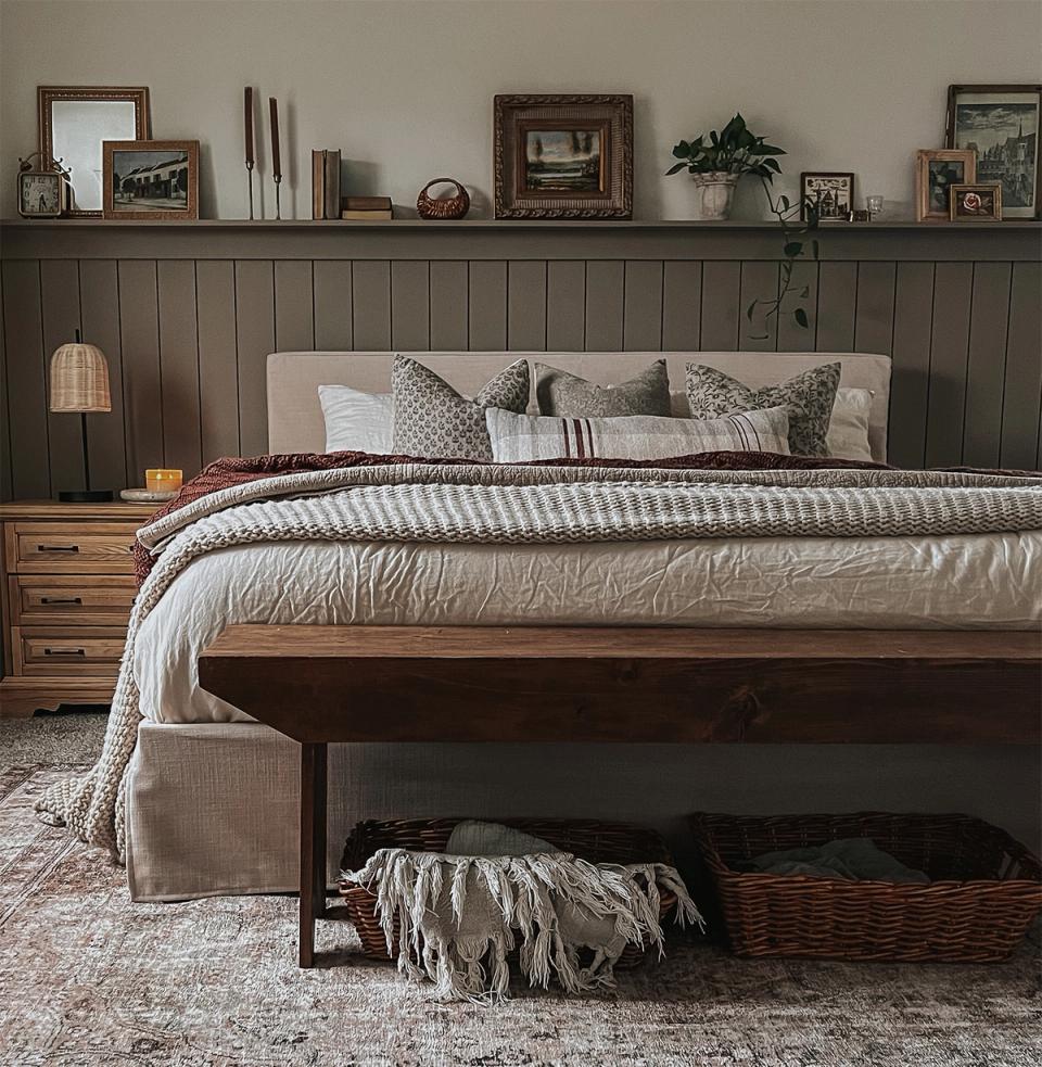 Earthy sage bedroom with shiplap accent wall, natural wood, and farmhouse-inspired calm