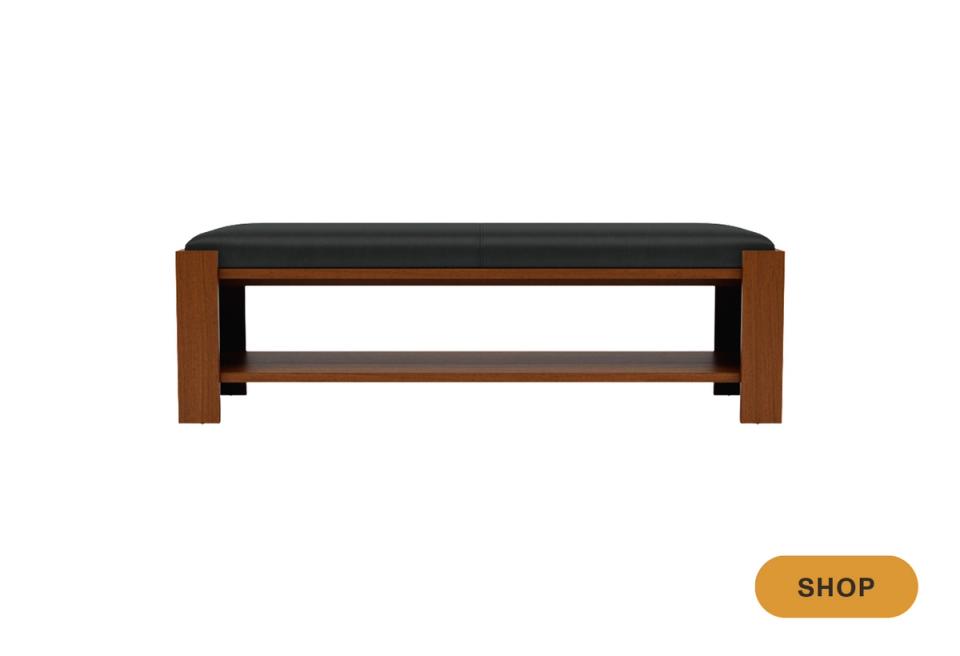 Mid-century modern bench with warm wood frame, black upholstered seat, and open geometric base structure