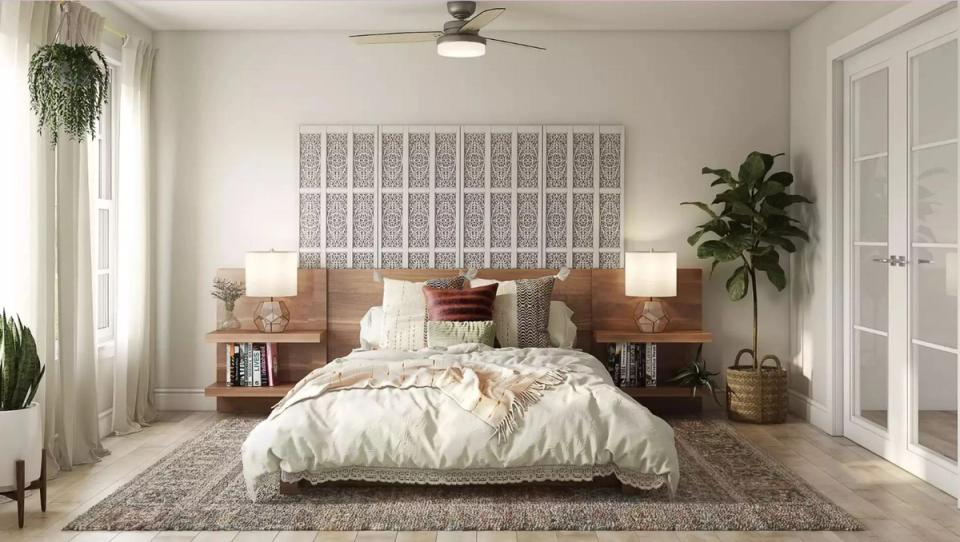 Scandinavian-inspired bedroom with geometric wall headboard, natural wood elements, and abundant greenery