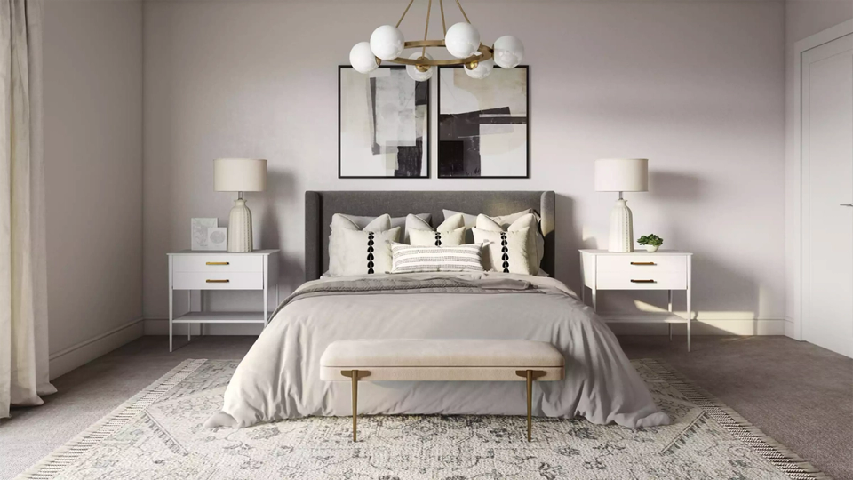 Serene gray bedroom with soft lighting, neutral bedding, and minimalist nightstands establishing a peaceful, sophisticated retreat.