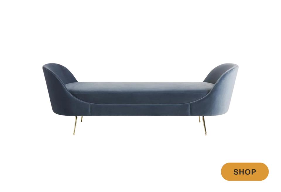 Modern slate blue daybed with curved arms and brass legs