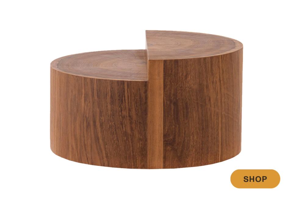 Mid-century modern walnut round coffee table with sculptural curved design