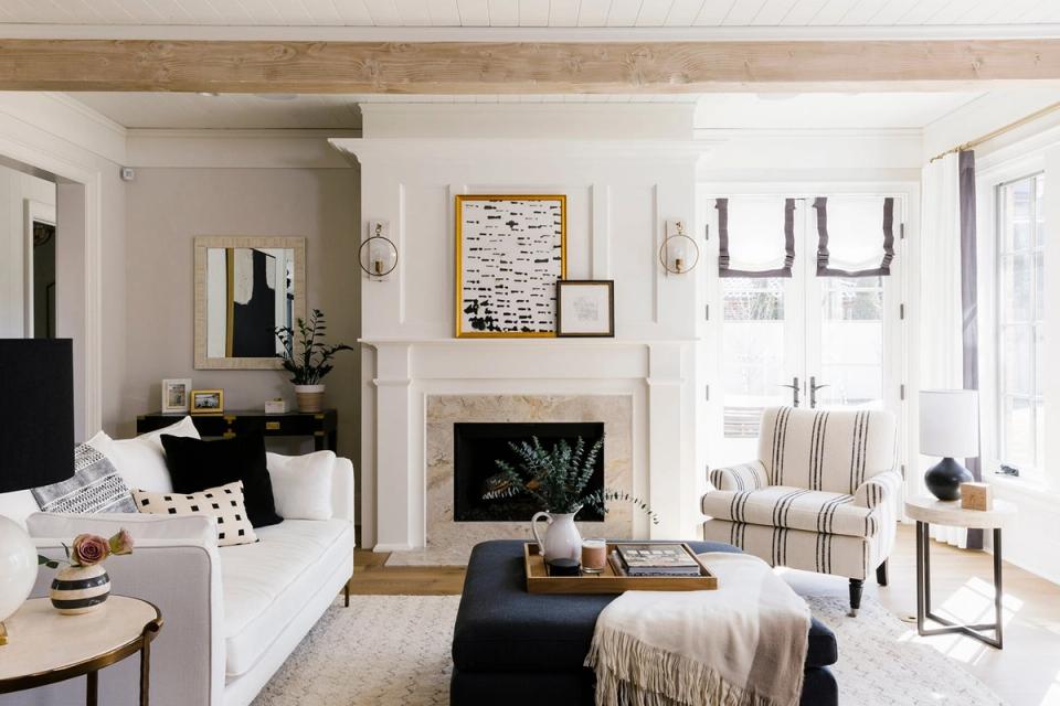 Classic transitional living room with black rectangular coffee table and neutral warm palette