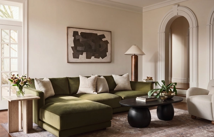 Living room with green velvet sectional, best online services