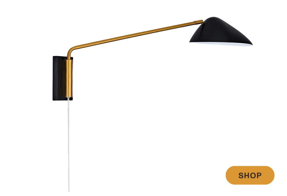 Modern brass and black sconce with geometric angled arm and angular shade