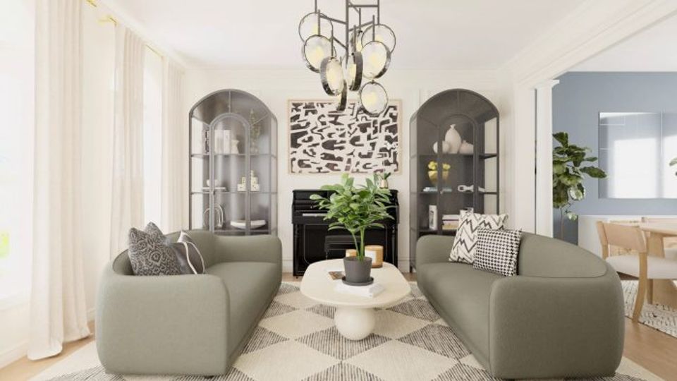 Contemporary sage green living room with symmetrical seating, curved archways, and soft neutral tones creating a serene, balanced aesthetic