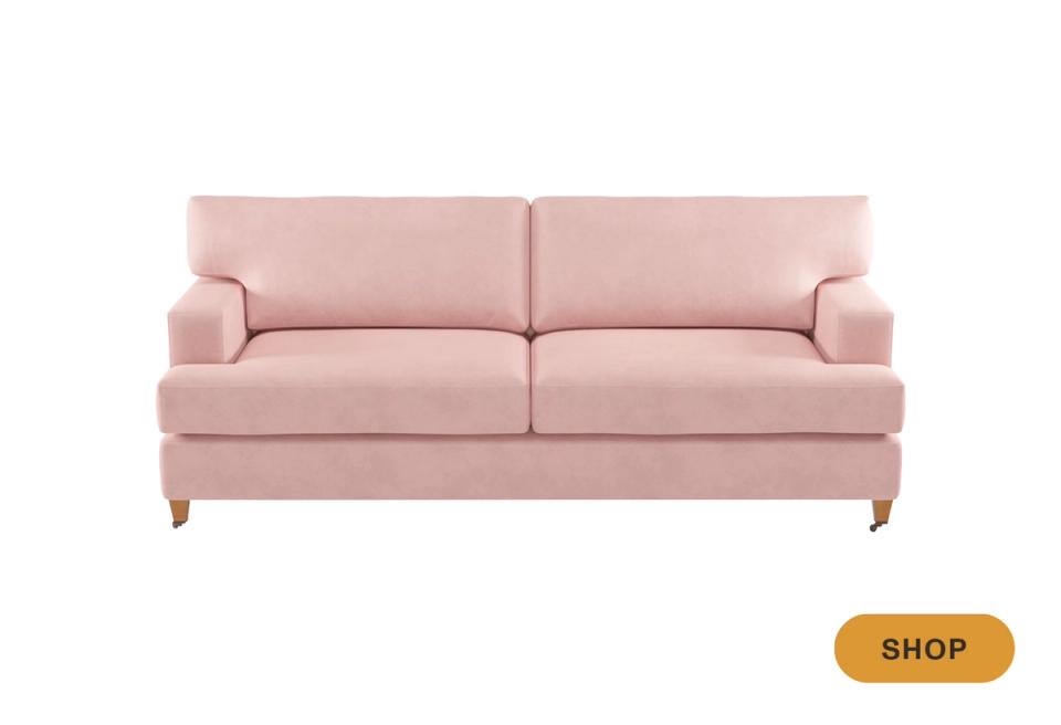 Soft blush pink traditional sofa with rolled arms and rolled feet detailing