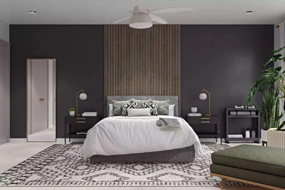 Bold contemporary bedroom with charcoal accent wall, wood-slat headboard, and geometric patterned rug