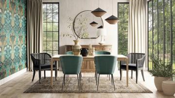 Modern sage green dining room with patterned wallpaper, natural wood table, and floor-to-ceiling windows.