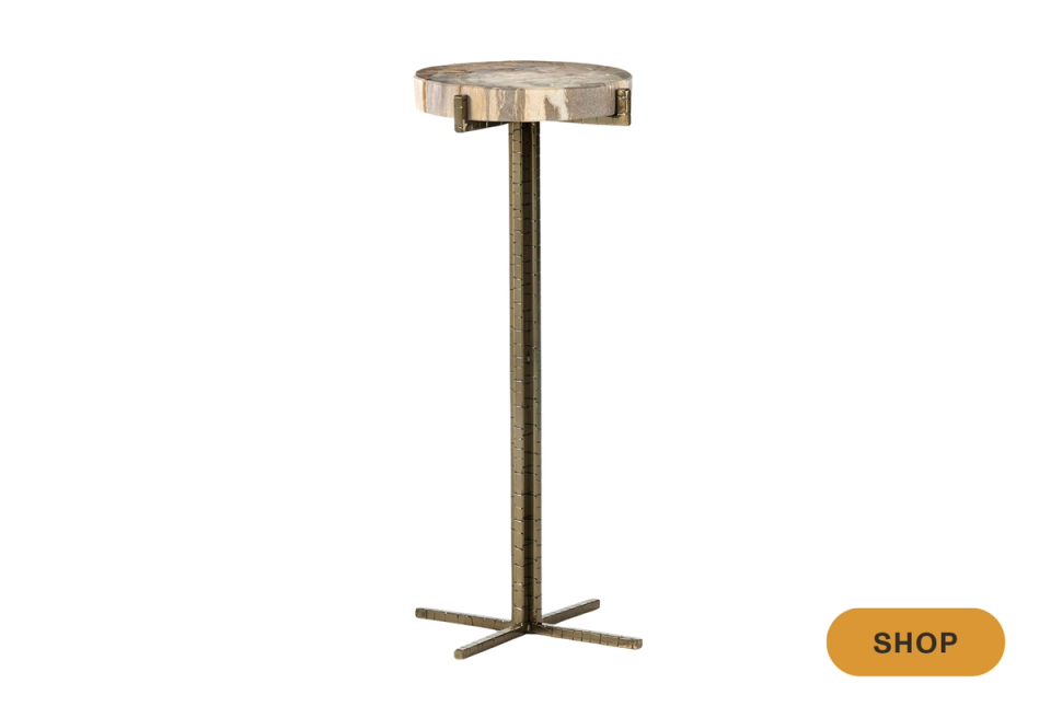 Mid-century modern martini table with antique brass top and minimalist pedestal base