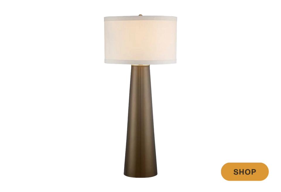 Tapered cone floor lamp with warm linen shade in neutral, minimalist style
