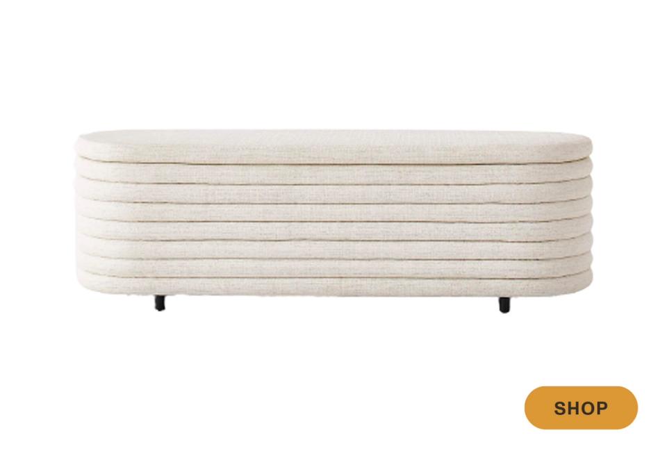 Contemporary cream upholstered bench with horizontal channel quilting and minimalist legs
