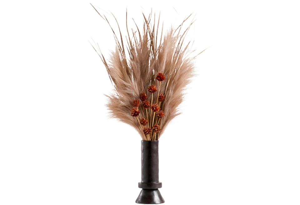 Warm boho dried arrangement with pampas grass and rust tones in black vase