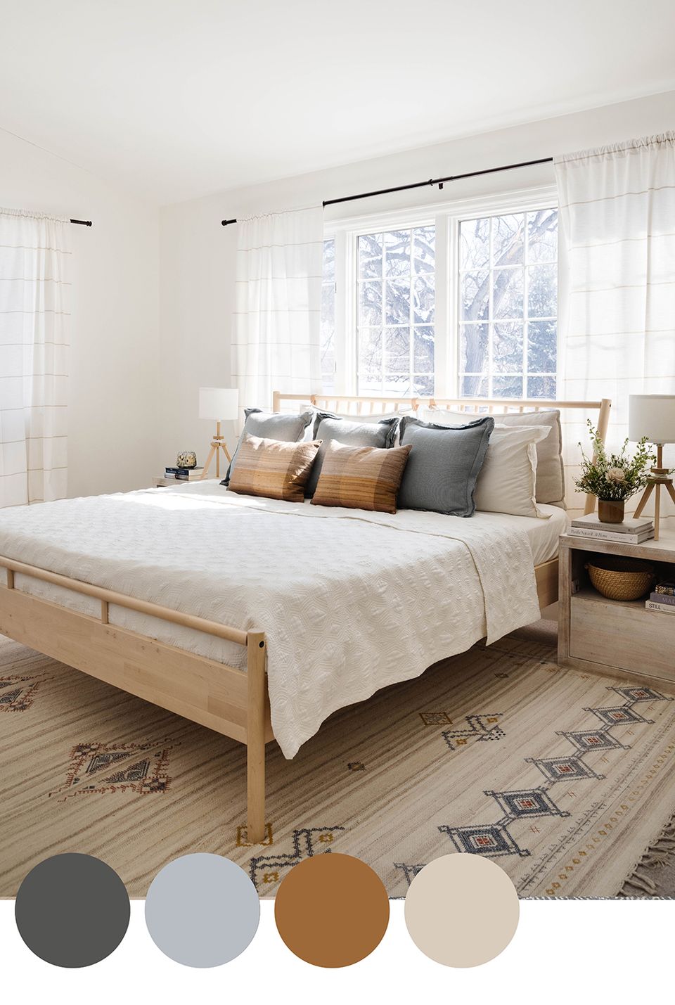 Scandinavian bedroom blending natural wood, warm caramel accents, and neutral tones with bright windows and geometric patterned rug.