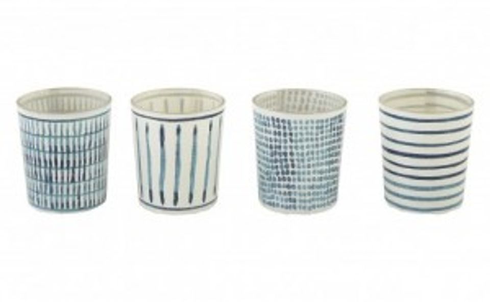 Blue and white striped ceramic vessels evoking coastal beach house aesthetic