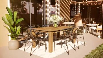 Warm-toned evening patio with wooden dining table, string lights, and bohemian garden atmosphere