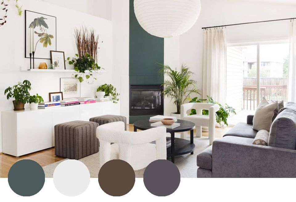 Serene living room blending sage green, warm neutrals, and charcoal tones with botanical accents and minimalist shelving.