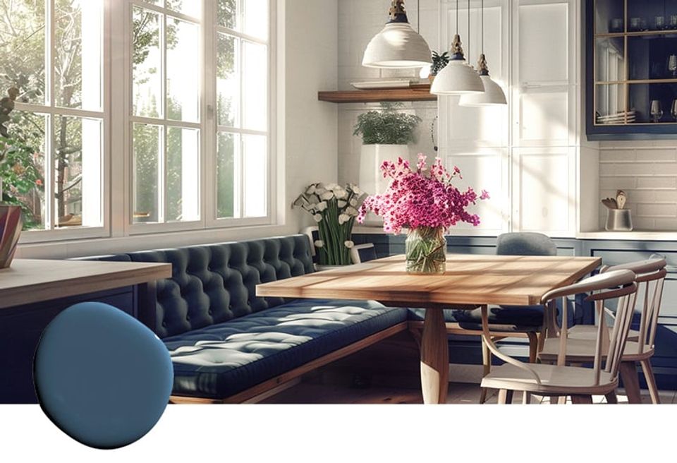 Scandinavian dining space with navy banquette seating, natural wood table, bright windows, and fresh florals