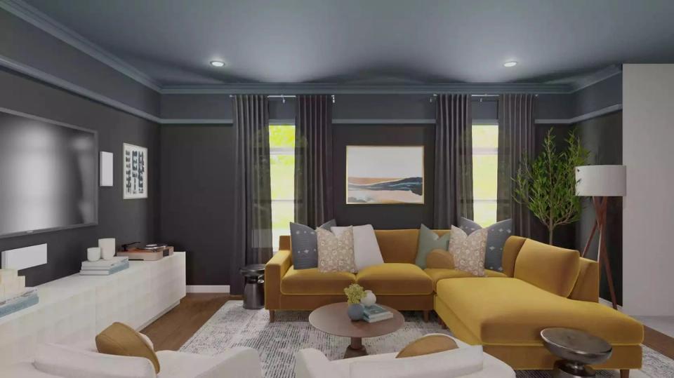 Moody dark gray living room with mustard velvet sectional, brass details, and sculptural seating