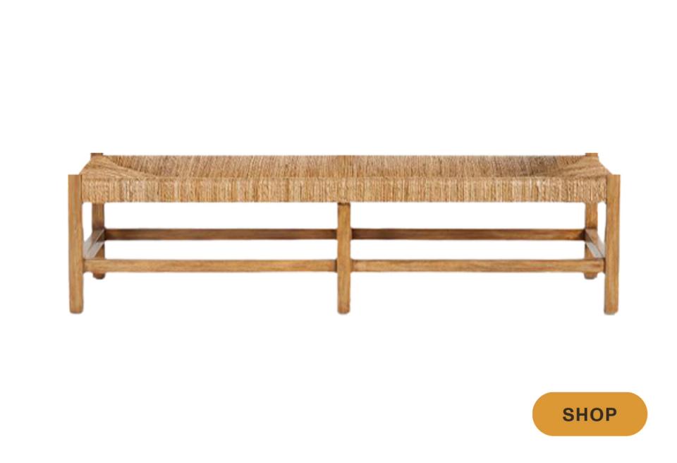 Rustic wooden bench with woven natural fiber seat and simple horizontal slat support, warm earthy tones