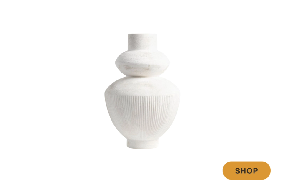 Textured white ceramic vessel with modern ribbed details and organic silhouette