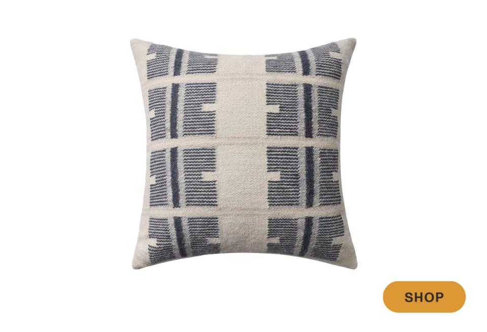 Contemporary geometric pillow in navy and cream with modern woven grid pattern