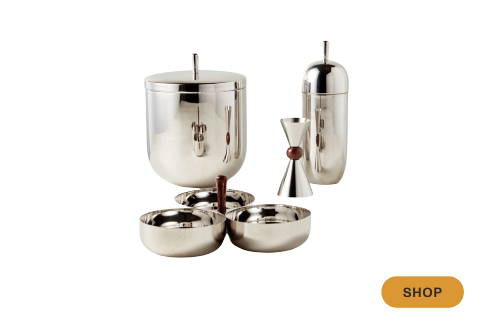 Modern polished stainless steel decorative vessels with sleek cylindrical forms and handles