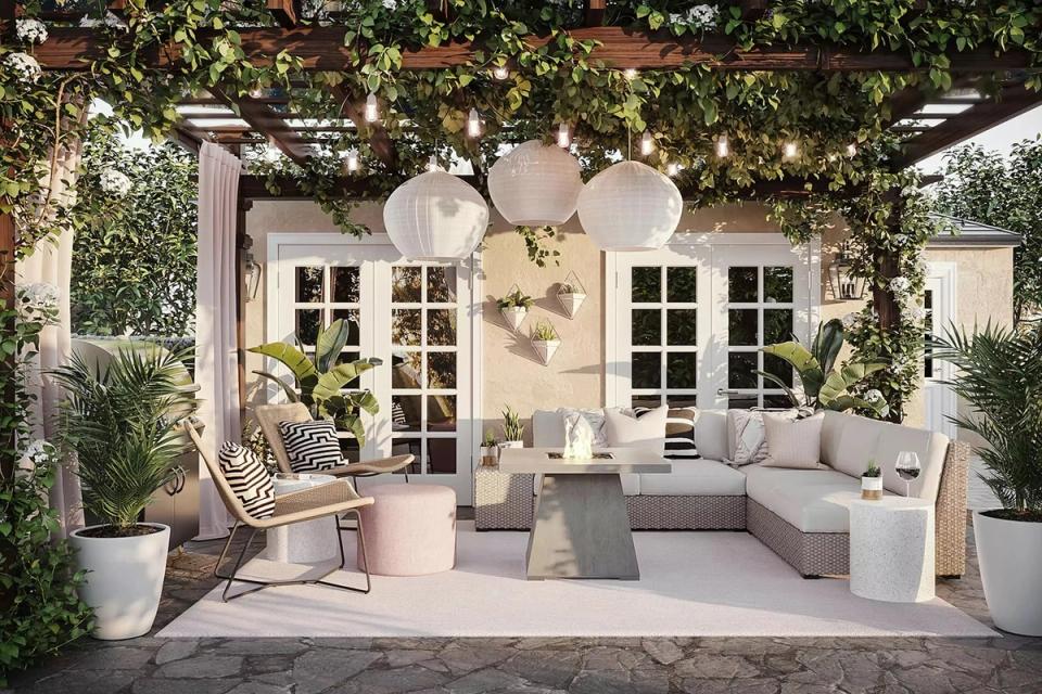 Serene coastal patio with cream furnishings, lush greenery, and soft neutral tones creating a tranquil retreat.