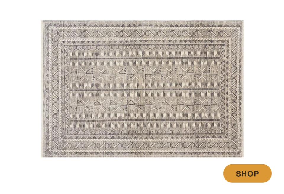 Bohemian textured area rug in sage and cream with tribal geometric border and patterns
