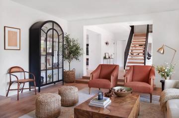 Bohemian living room with terracotta accents, woven poufs, and natural wood coffee table