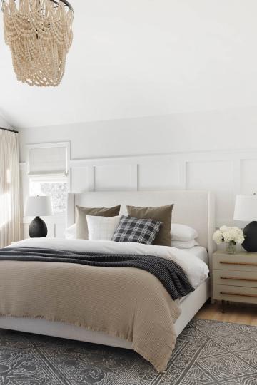 Contemporary white bedroom with soft shiplap accent wall, neutral palette, and modern simplicity