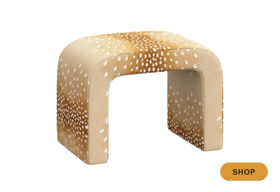 Curved sculptural bench in cream with dotted texture pattern, contemporary organic design