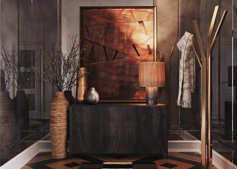 Dramatic moody entryway with warm amber accent lighting, dark wood paneling, and layered bronze tones.