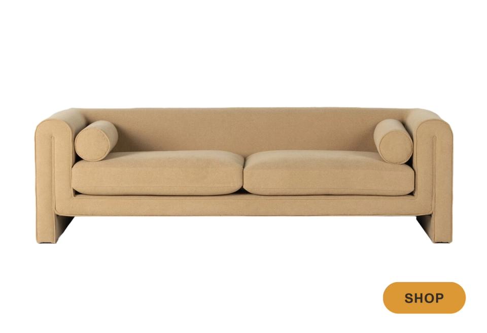 Geometric camel sofa with bold wooden block arms and modern architectural design