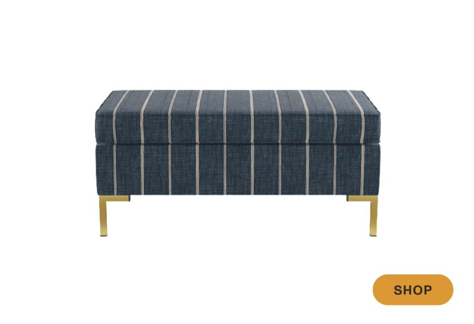 Modern navy pinstriped bench with brass legs, blending transitional style and geometric pattern